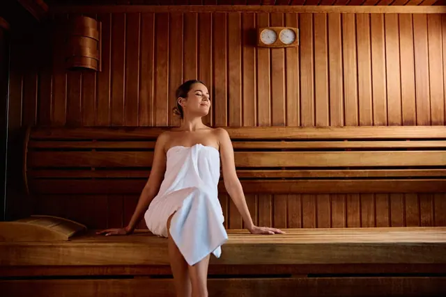Warm wood interior of the infrared sauna at Bossa.
